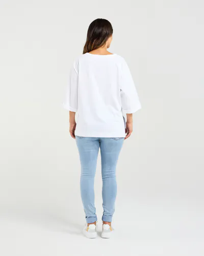 Model wearing White Kate T-Shirt By Zafina Available at Beetees Nelson